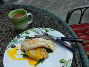 fried eggs on nest of spinach