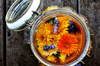 calendula and lavender flowers steeping in grape seed oil